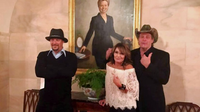 The trio pose mockingly in front of a portrait of former first lady and Secretary of state Hillary Clinton. (Photo: Sarah Palin)