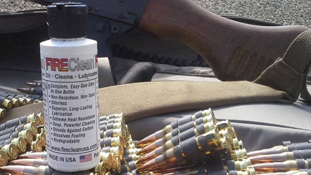 A bottle of FireClean on top of linked ammunition. (Photo: FireClean/Facebook)