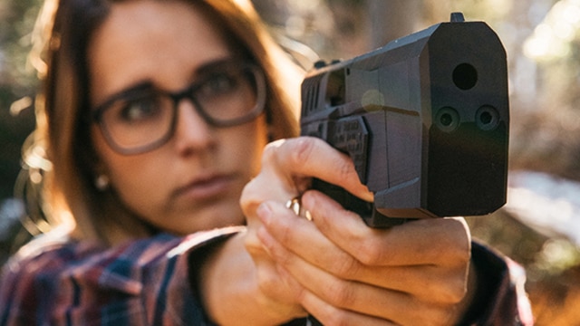 A woman demonstrating the pointability of the Maxim 9 pistol. (Photo: SilencerCo)