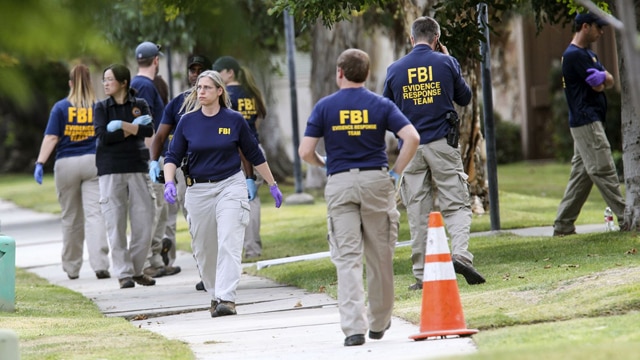 FBI pictured outside the San Bernardino shooters' house in December 2015. (Photo: Ringo H.W. Chiu/AP Photo)