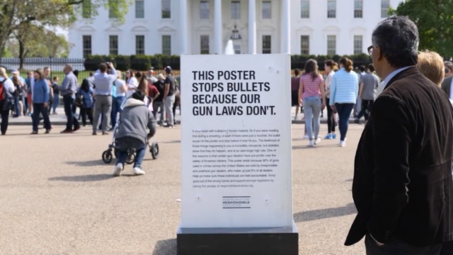 Americans for Responsible Solutions placed a bullet proof poster in front of the White House in support of expanded background check laws. (Photo: AdWeek)