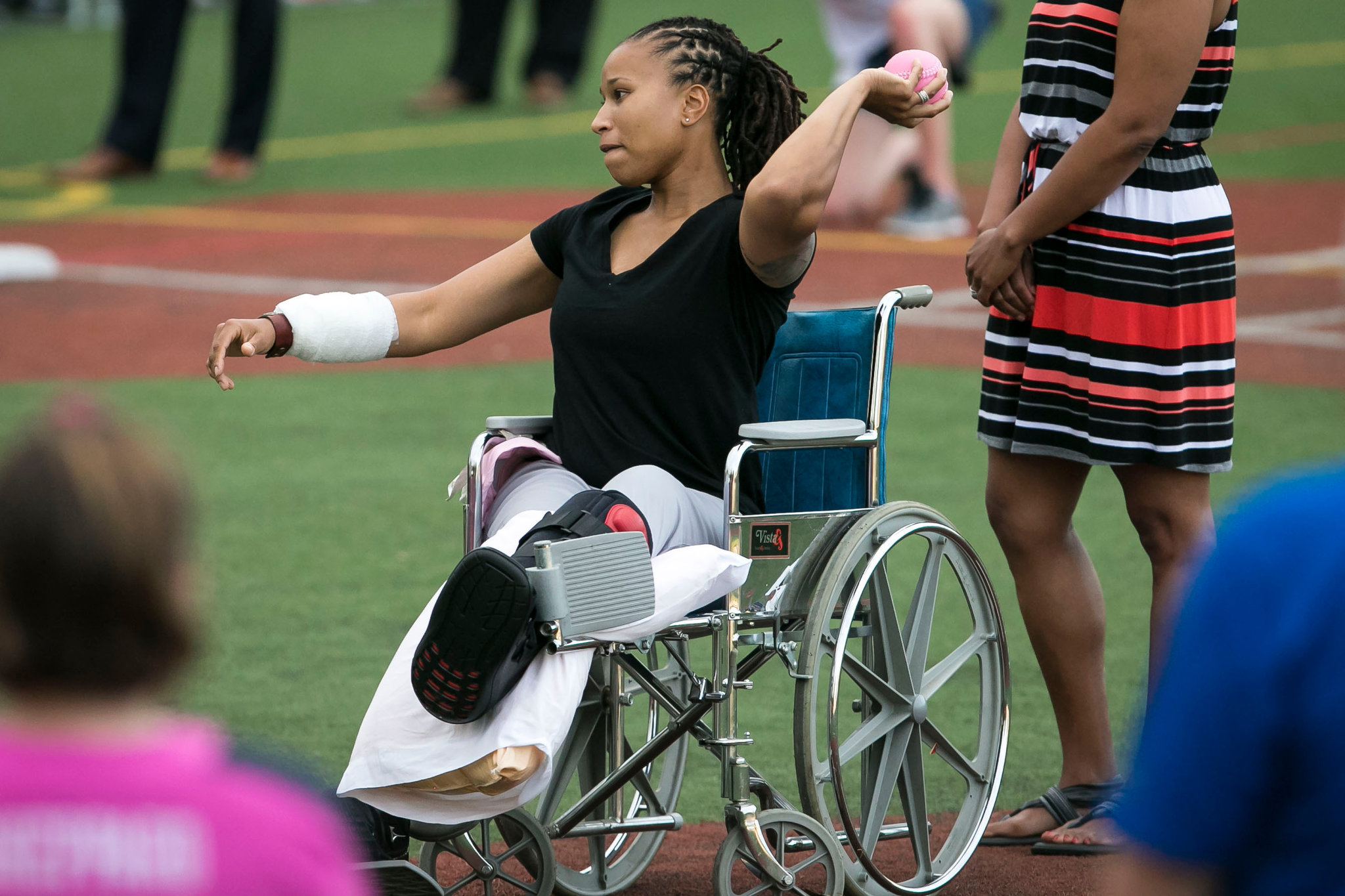 Crystal Griner, a Capitol Police officer injured in last week’s shooting at a congressional baseball practice, threw the first pitch at the annual Congressional Women’s Softball Game in Washington on Wednesday. (Photo: Al Drago/The New York Times)
