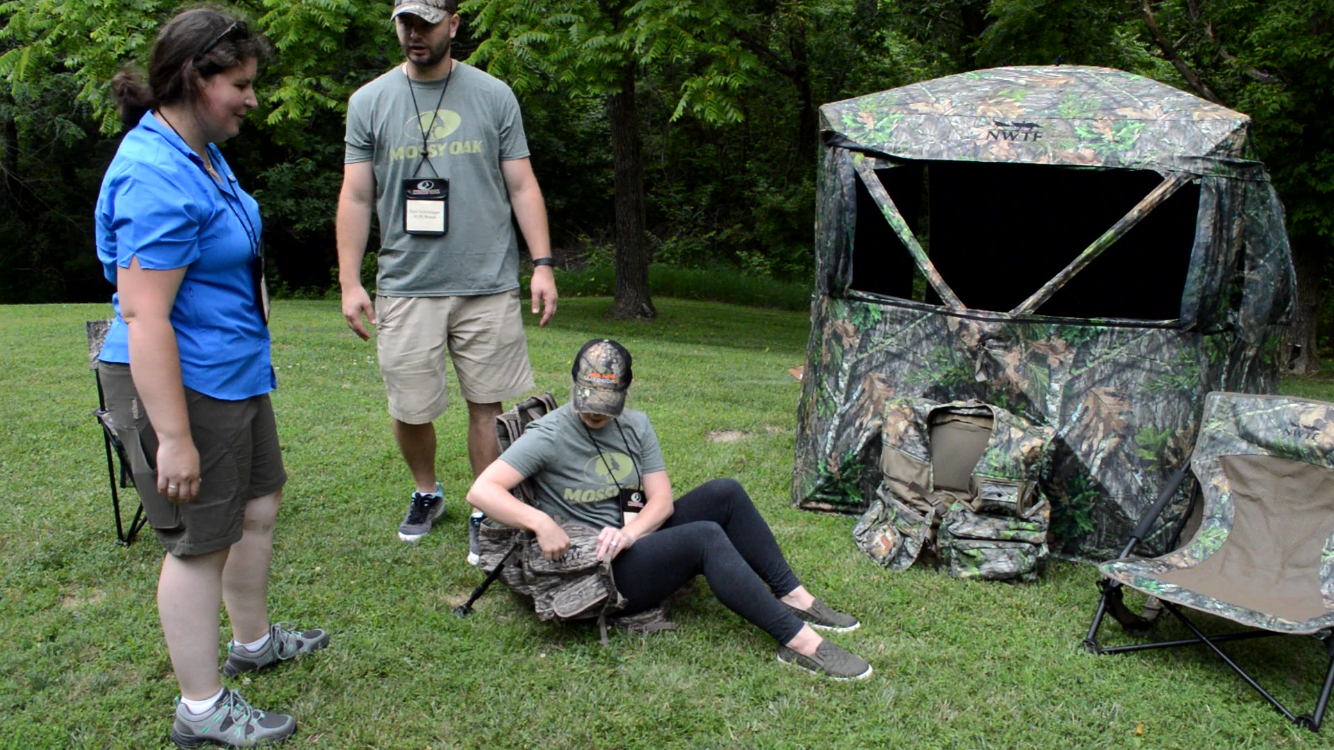 Zach and Sarah from Alpz Brands show off their NWTF vests and blinds for turkey hunters. Here, Sarah demonstates the comfort of the Grand Slam vest, built with a removeable kickstand frame, adjustable legs, and a foldaway padded seat. (Photo: Kristin Alberts)