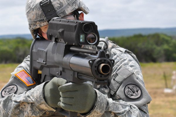 An Army soldier aims the XM25 Counter-Defilade Target Engagement System, a 25mm airburst grenade launcher the military sought to procure. (Photo: Department of Defense)