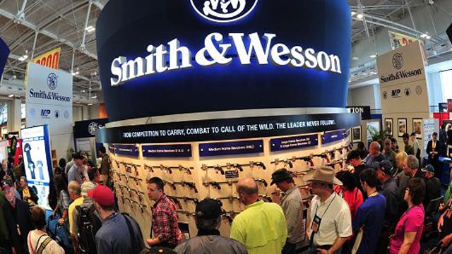 Convention goers look at weapons at the Smith and Wesson booth last April at the 2015 NRA Annual Convention in Nashville, Tennessee. (Photo: Karen Bleier/AFP/Getty Images)