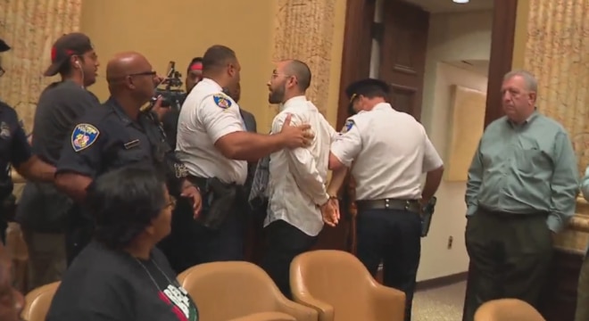 Two were arrested after a scuffle following lengthy hearings this week on a controversial proposal to establish a mandatory minimum sentence for those found with handguns near Baltimore schools, parks, and other public buildings. (Photo: WBFF)