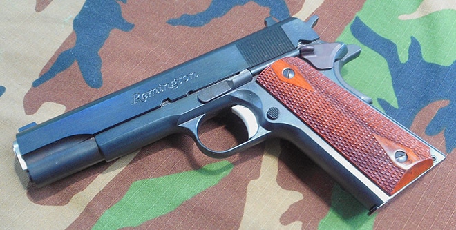 remington r1 1911 on camoflauge background