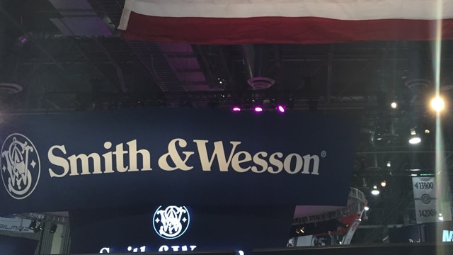 A Smith & Wesson sign below a giant American flag at SHOT Show 2017 in Las Vegas. (Photo: Daniel Terrill)