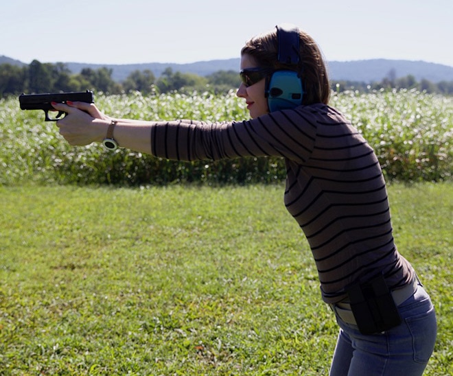 side view of female shooting a glock 19