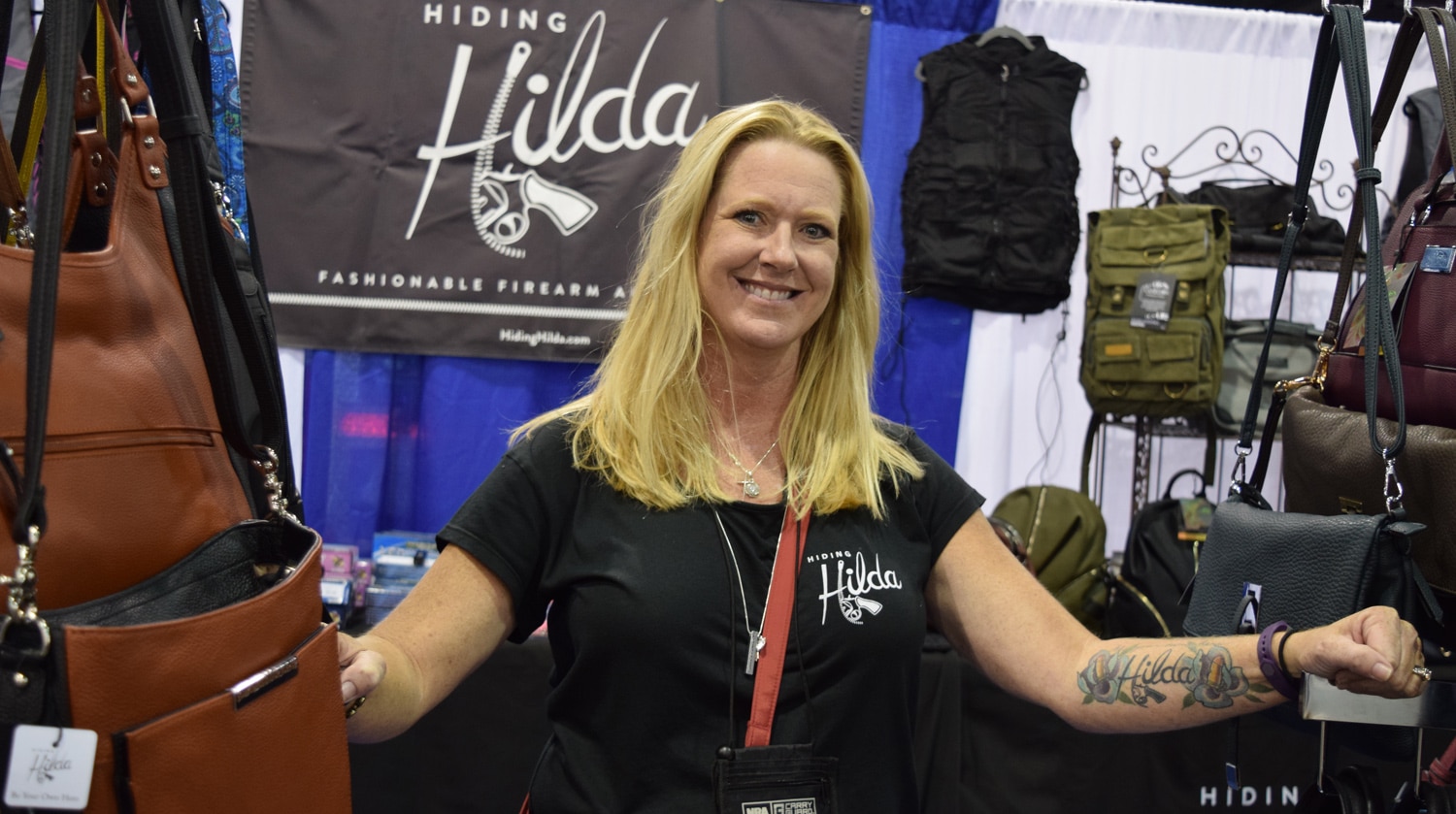 Dawn Hillyer, president of Hiding Hilda, is so proud of her concealed carry purse company she got the name tattooed on her forearm. (Photo: Daniel Terrill/Guns.com)