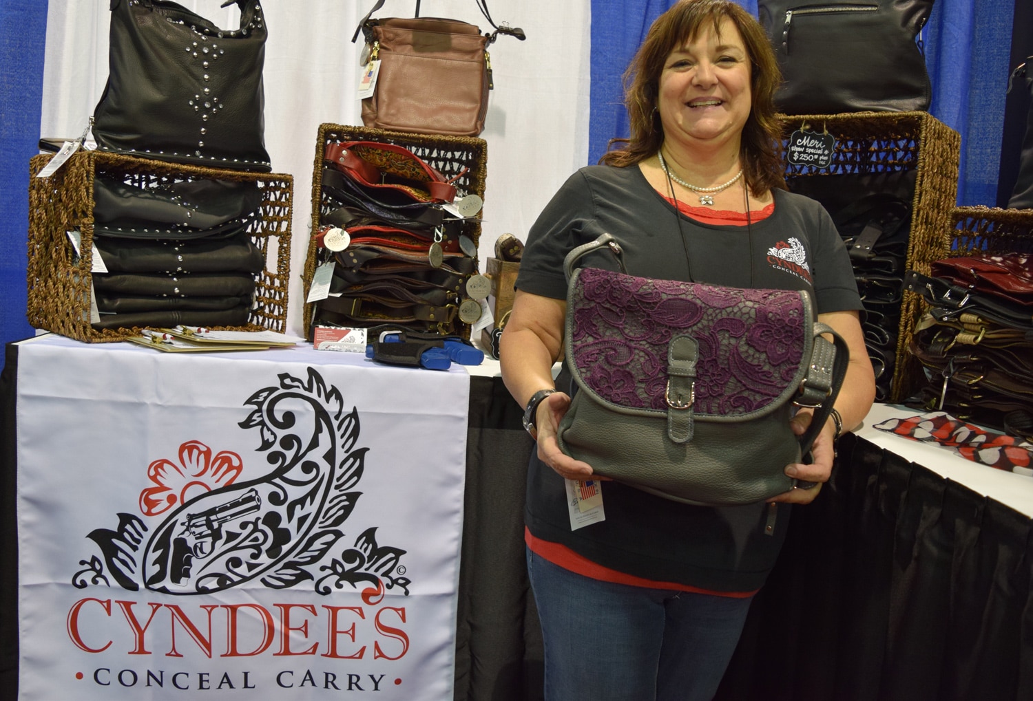 Cyndee Harding, owner and designer of Cyndee's Conceal Carry, highlights her bags and lacy motif. (Photo: Daniel Terrill/Guns.com)
