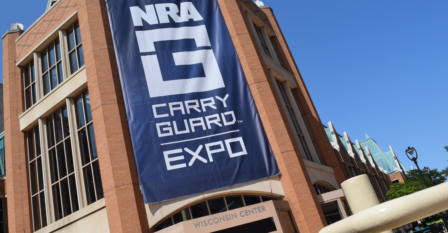 The ginormous "NRA Carry Guard" sign draped down the front entrance of the Wisconsin Center in Milwaukee on Friday, Aug. 25, 2017. (Photo: Daniel Terrill/Guns.com)
