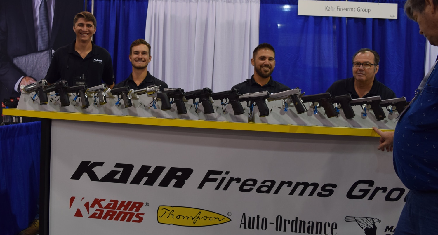 The bros at Kahr Arm sat behind their tall booth at the NRA Carry Guard Expo. (Photo: Daniel Terrill/Guns.com)