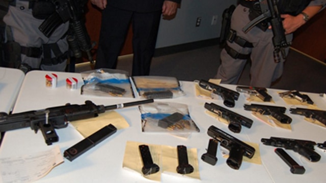 Seized guns taken during Project Rebel, a joint operation involving Ontario, ATF and U.S. Immigration and Customs Enforcement. (Photo: The Canadian Press)