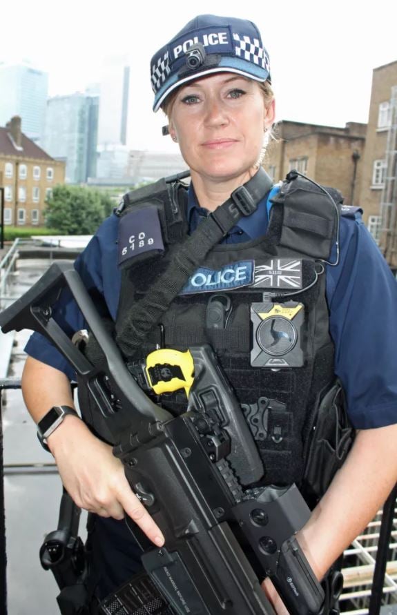 Armed police officer with head-mounted camera. (Photo: MPS)