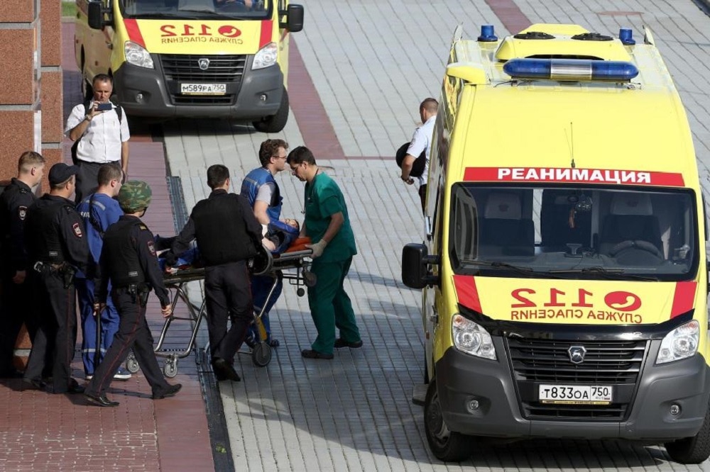 A wounded victim being carried to an ambulance outside the Moscow Regional Court. (Photo: AP)