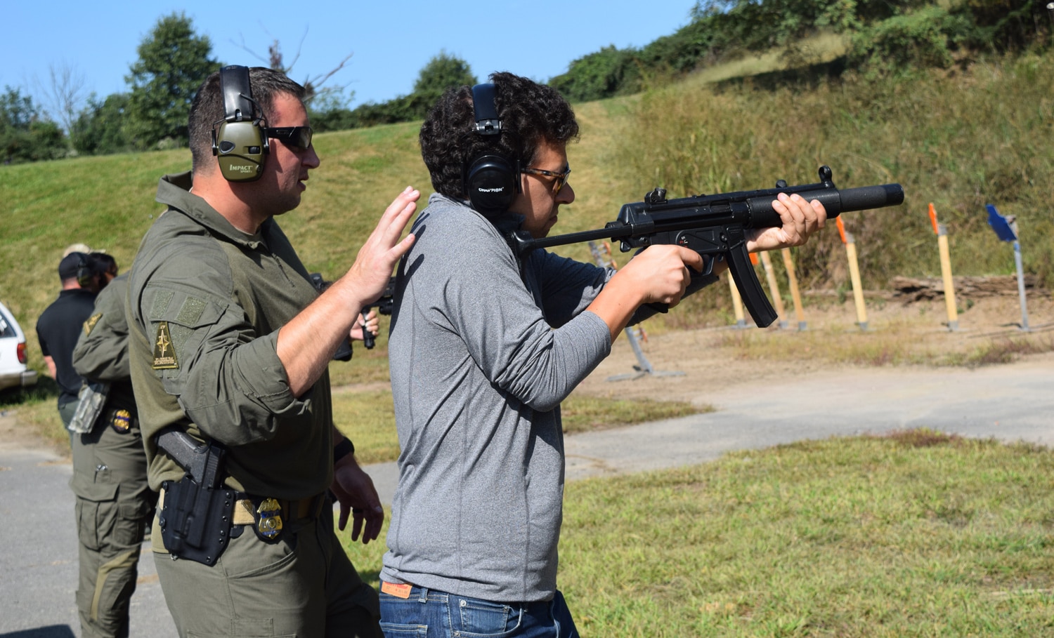 An ATF SRT agent guiding a reporter through shooting an HK MP5 machine gun, which is actually no longer used by the team. (Photo: Daniel Terrill/Guns.com)