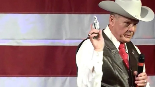 Judge Roy Moore showed off his revolver during a campaign rally on election day in Alabama. 