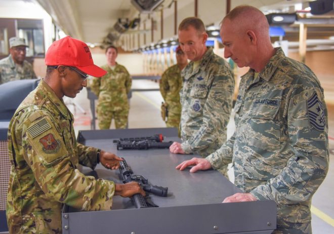 A USAF Security Forces combat arms instructor shows Maj. Gen. James Dawkins Jr., 8th Air Force commander, and Chief Master Sgt. Alan Boling, 8th Air Force command chief, how to assemble an Aircrew Self Defense Weapon at Dyess Air Force Base, Texas, Oct. 4, 2018. (Photo: USAF)