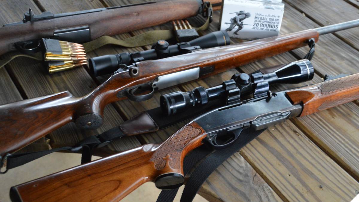 Remington 7400, M30 and M1 Garand rifles on a target bench