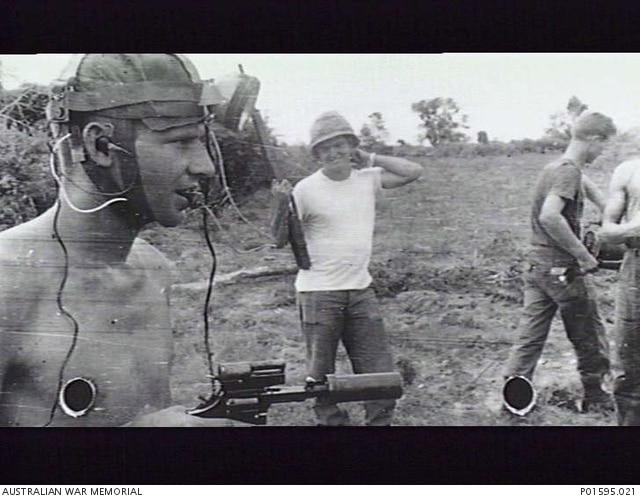 Australian combat engineer assisting American forces in Vietnam with tunnel clearing operations Vietnam Phuoc Tuy Province 1966 note S&W Smith Wesson suppressed revolver AWM P01595.021