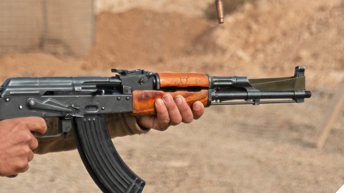 Syrian Democratic Forces soldier fires a Kalashnikov rifle during weapons training in Deir ez-Zor province, Syria, Nov. 29, 2018