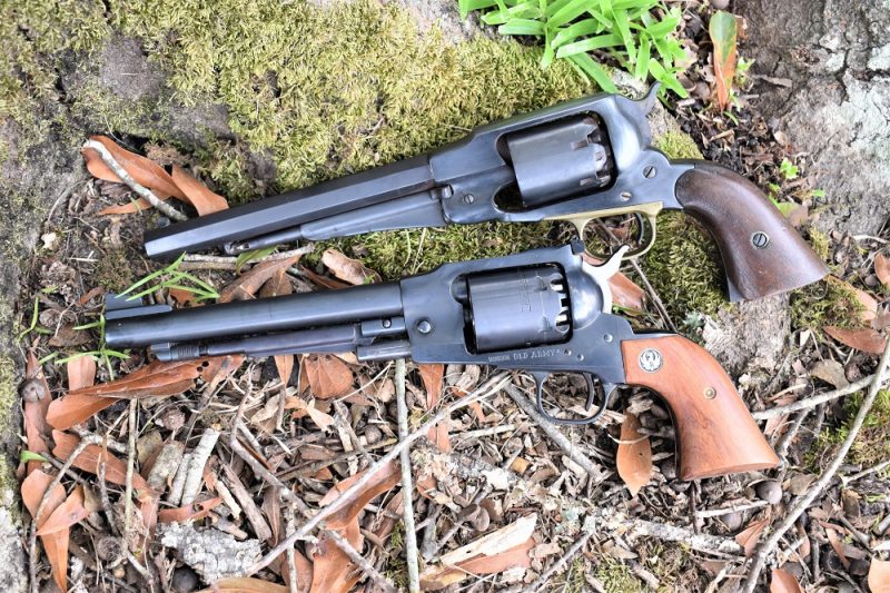 The top revolver is a circa 1865 martially-marked Remington New Army while the "identical cousin" below it is a 1999-produced Ruger Old Army. (Photo: Chris Eger/Guns.com)