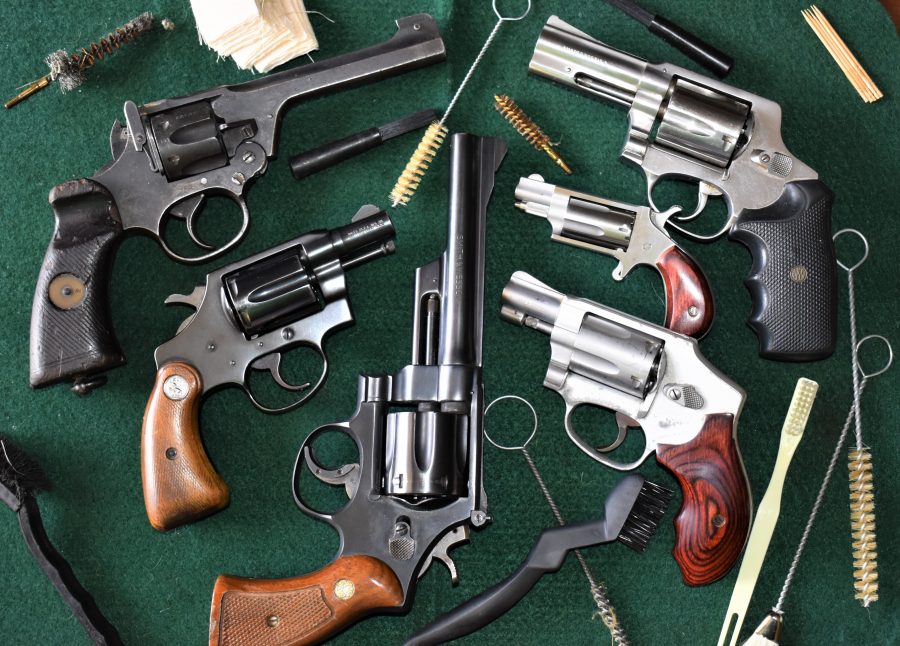 This cross section of wheel guns covers five manufacturers across three continents and includes a little bit of everything-- but they can all generally be cleaned the same. The spread includes a WWII British Enfield No.2 Mk I* in .38/200, a Colt Detective Special, Smith & Wesson Model 28 Highway Patrol in .357 Magnum, S&W 642 Airweight, a single-action North American Arms .22WMR Mini Revolver, and a DAO 1970s Rossi M720 .44 Special. (All photos: Chris Eger/Guns.com)
