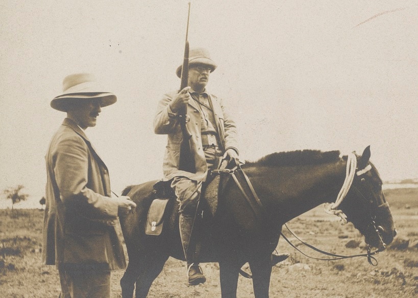 Roosevelt on horseback, holding what looks to be the modified M1903 rifle. The man standing next to him is possibly Kermit Roosevelt. The image was from a 1910 African safari. (Photo: Library of Congress)