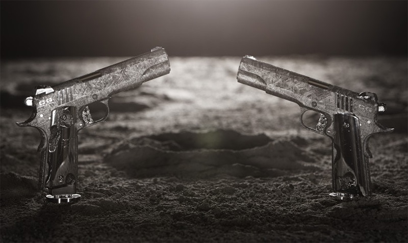 two 1911s facing eachother on artistic dark background