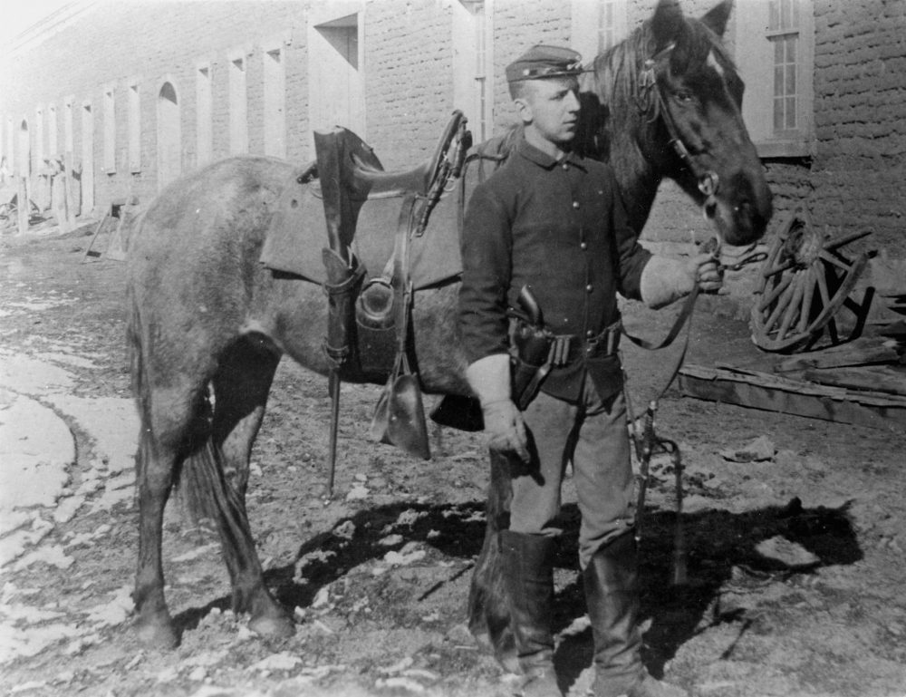 Cavalry Soldier and horse in Mechanics Corral, Fort Union. Note his Colt 1873 SAA (Photo: National Park Service)