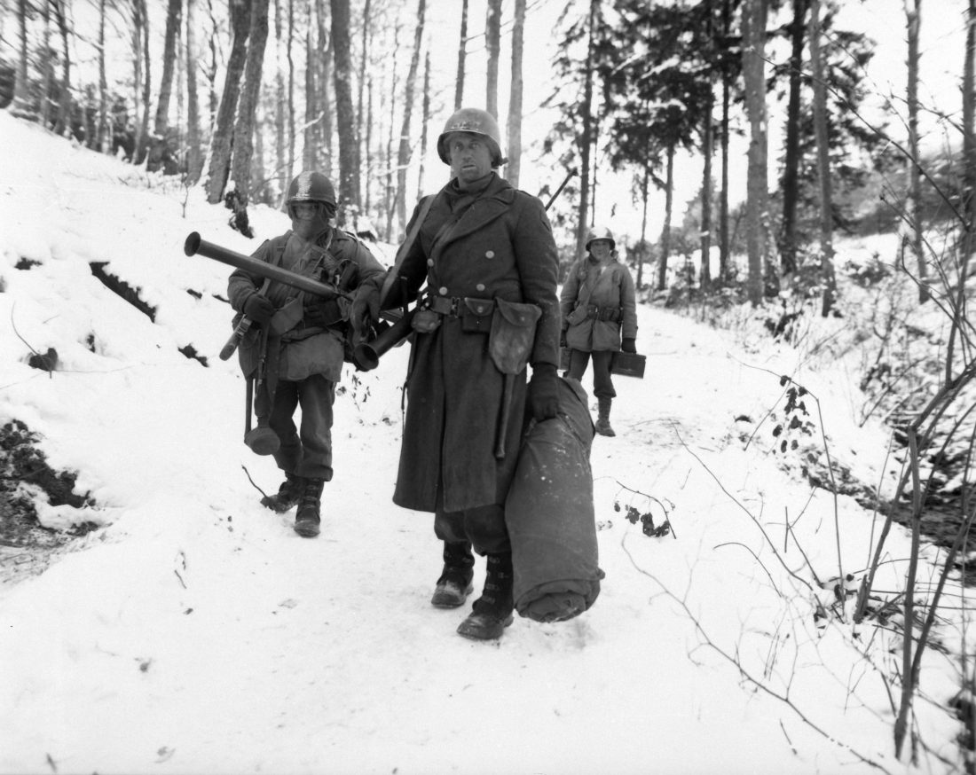 American engineers emerge from the woods and move out of defensive positions after fighting in the vicinity of Bastogne, Belgium, December 1944. Note the M1 Garand, M1 Carbine and M9 Bazookas, along with a liberal sprinkling of grenades and spare ammo. (Photo: U.S. Army)