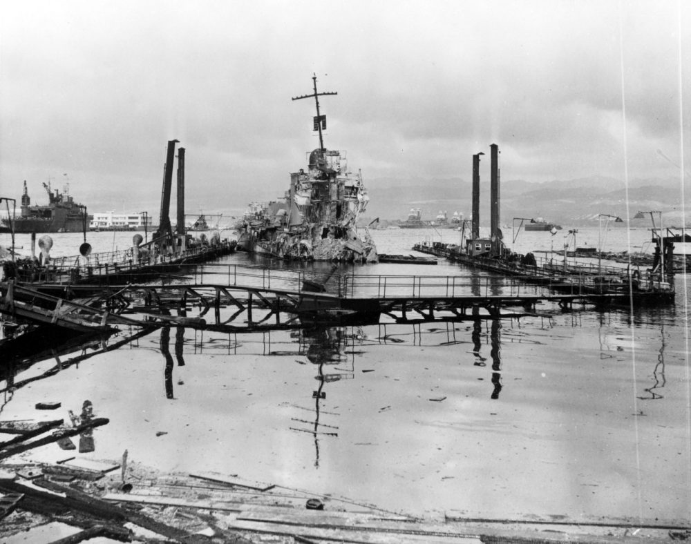 A view inside the drydock, then sunk and full of water, the day after the attack. USS Shaw is seen severely damaged in the center of the dock. (Photo: U.S. Navy)