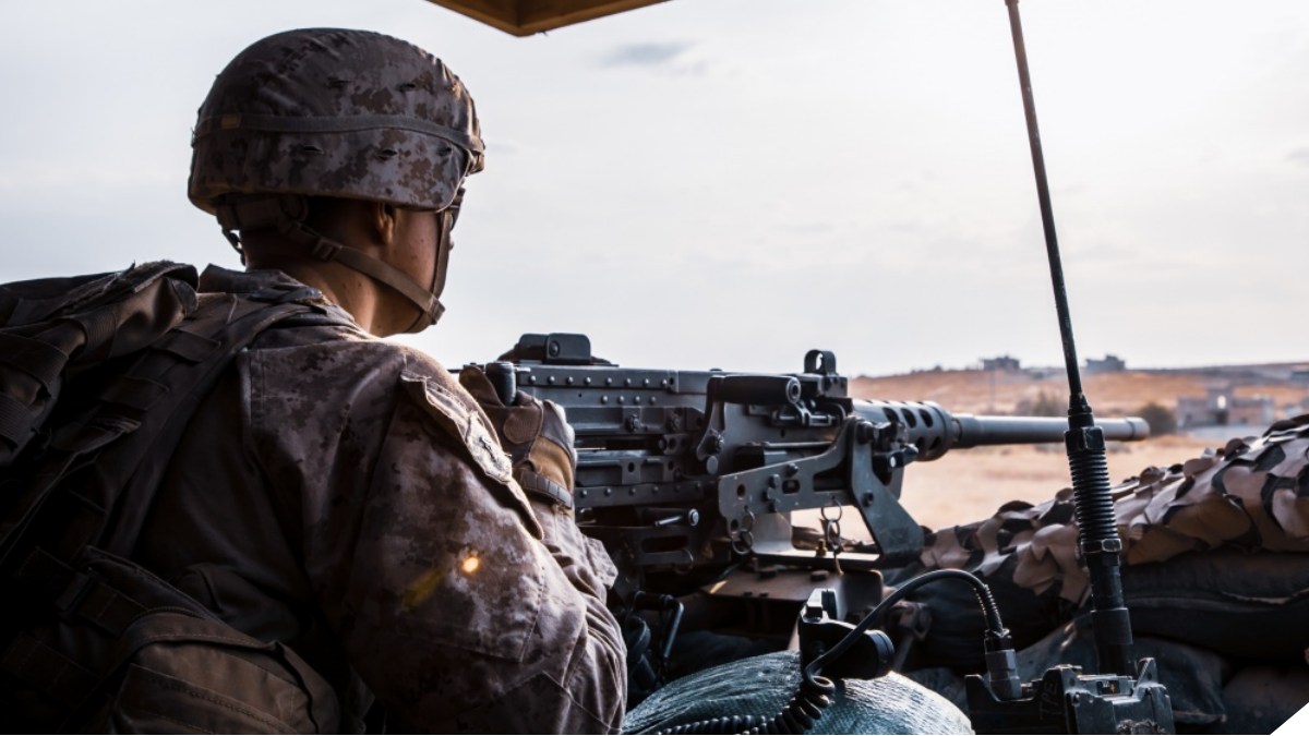 A U.S. Marine with 2nd Battalion, 7th Marines, attached to the Special Purpose Marine Air-Ground Task Force – Crisis Response – Central Command (SPMAGTF-CR-CC) 19.2, mans a M2 .50 caliber heavy machinegun at an undisclosed location in Syria, October. 16, 2019. The SPMAGTF-CR-CC is a multiple force provider designed to employ ground, logistics, and air capabilities throughout the central command area of responsibility. (U.S. Marine Corps photo by Sgt. Branden J. Bourque)