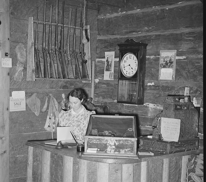 "Manageress of Navajo Lodge at the desk. Datil, New Mexico."