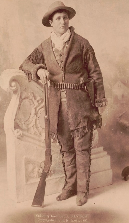 A cabinet portrait of Calamity Jane, Gen. Crook's scout taken in Deadwood SD 1895 Winchester rifle SW revolver LOC
