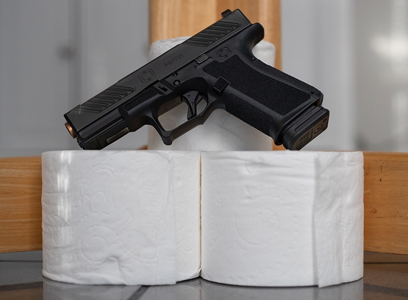 Handgun and toilet paper