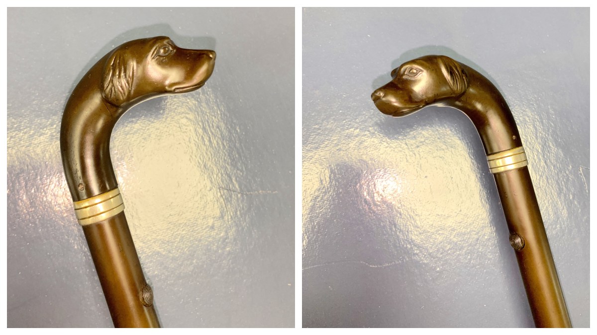 Remington Rifle Cane head, showing two views of a small carved dog head