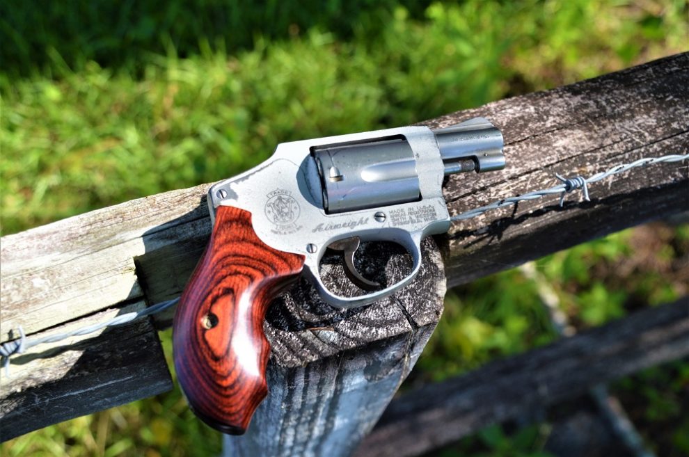 Smith Wesson 642 on a wooden fence