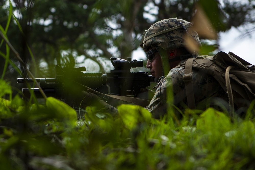 Cpl. Daniel Collacott, a rifleman with Charlie Company, Battalion Landing Team, 1st Battalion, 4th Marines, holds security during platoon attack training at Camp Schwab, Okinawa, Japan, Feb. 28, 2019. Collacott, a native of Colorado Springs, graduated from Discovery Canyon High School in May 2014 before enlisting in June 2015. During the training, Marines with Charlie Company refined their ability “To locate, close with and destroy the enemy by fire and maneuver, or repel the enemy’s assault by fire and close combat,” the mission of the Marine Corps rifle squad. Charlie Company Marines are the airborne raid specialists with BLT 1/4, the Ground Combat Element for the 31st Marine Expeditionary Unit. The 31st MEU, the Marine Corps’ only continuously forward-deployed MEU, provides a flexible and lethal force ready to perform a wide range of military operations as the premier crisis response force in the Indo-Pacific region. (U.S. Marine Corps photo by Gunnery Sgt. T. T. Parish/Released)
