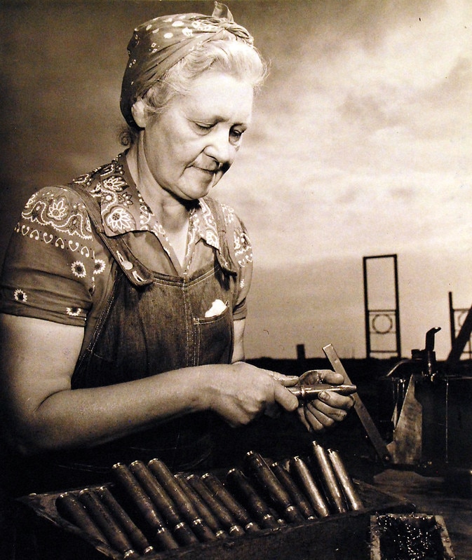 "Netherlands-born Mrs. Catherine Melker, the 58-year old former dress designer and teacher, is one of the most ardent and hard-working “WOWS’ at Dahlgren Proving Grounds. She is greasing bullets for the test-firing lines.