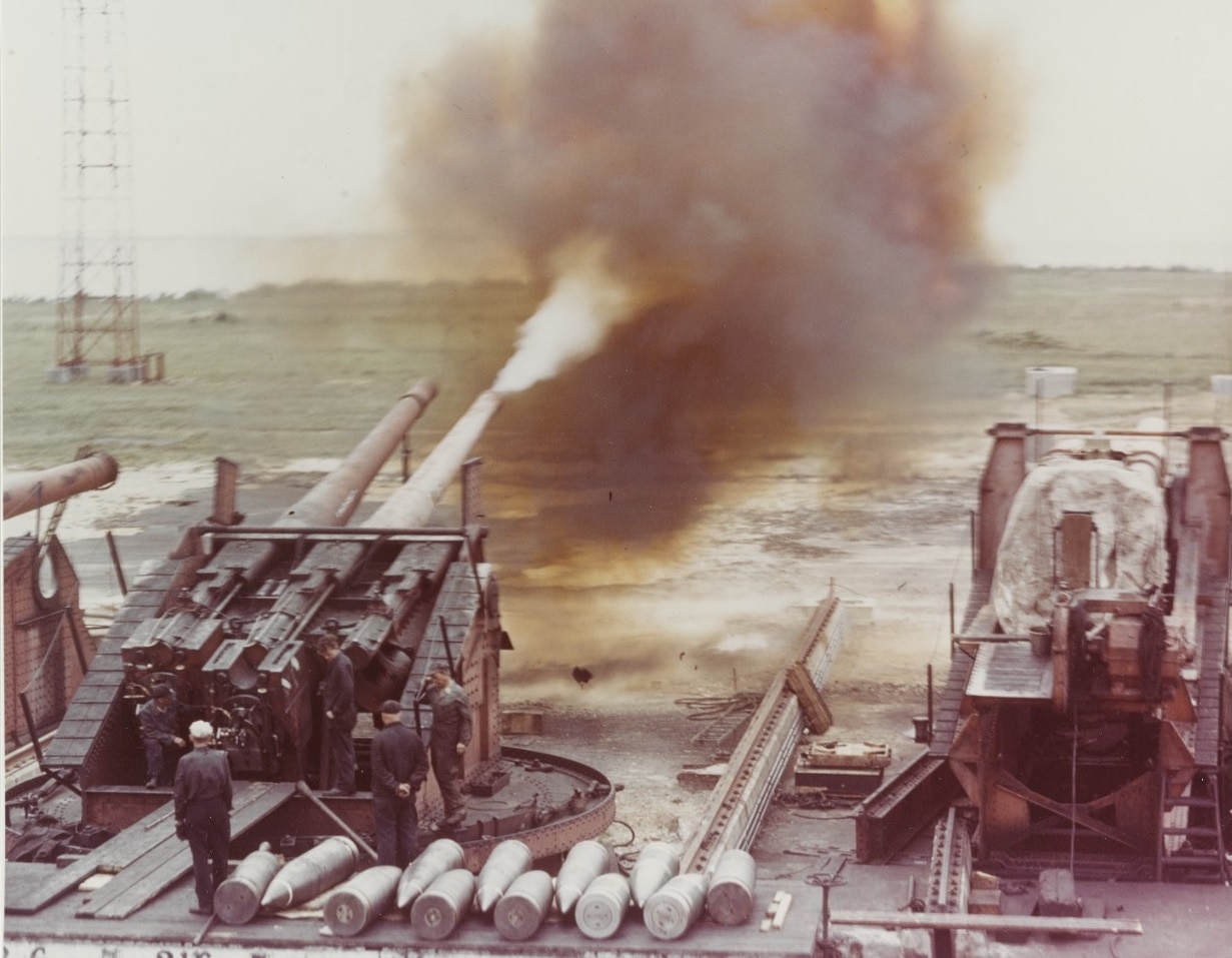 80-G-K-13599 Dahlgren Firing an eight-inch, 55-cal. Gun, during tests in World War II. This is a triple, single sleeve gun mount, with the right barrel removed