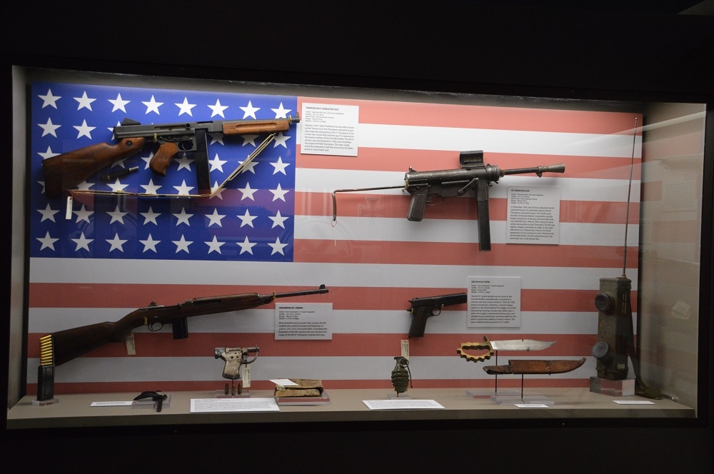 U.S. military firearms of WWII, including the M3 Grease Gun and Thompson M1 submachine guns, the M1 Carbine, the "Liberator" single-shot .45ACP pistol, and M1911A1 .45 Government Issue, (Photo: Chris Eger/Guns.com)