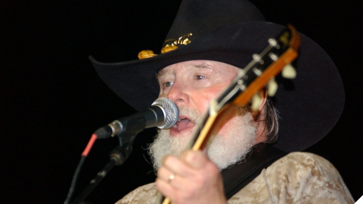 "Country music legend Charlie Daniels belts out the tunes at a concert in front of 4th Infantry Division headquarters. Camp Liberty was the final stop on the band's second concert sweep through Iraq as part of the 2006 Stars for Stripes tour." (Photo & Caption: U.S. Army)