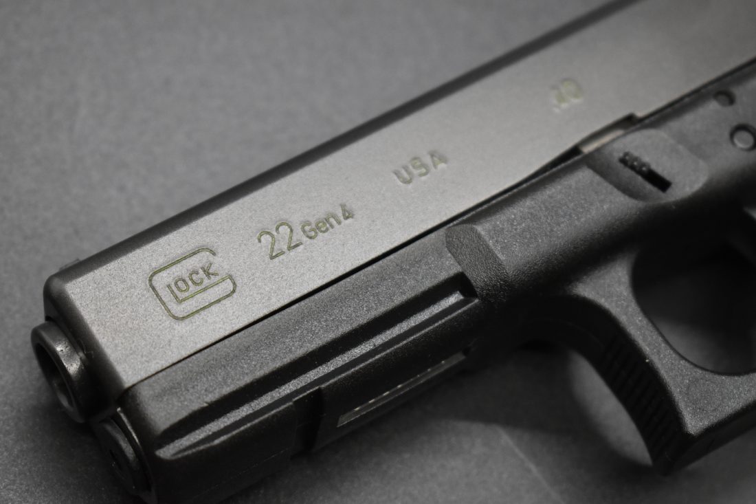 A 4th Gen Glock G22 on a black background