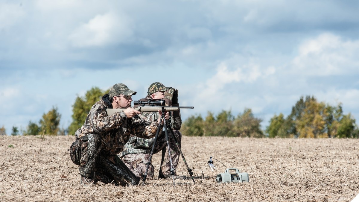 Two Men with a Ruger American rifle in the field