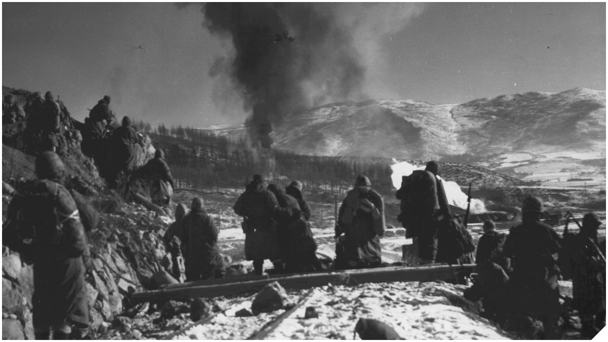 Marines South of Hagaru-ri, Korea, December 6, 1950 while "Marine and naval air are working over enemy positions with napalm." (Photo: USMC Archives)